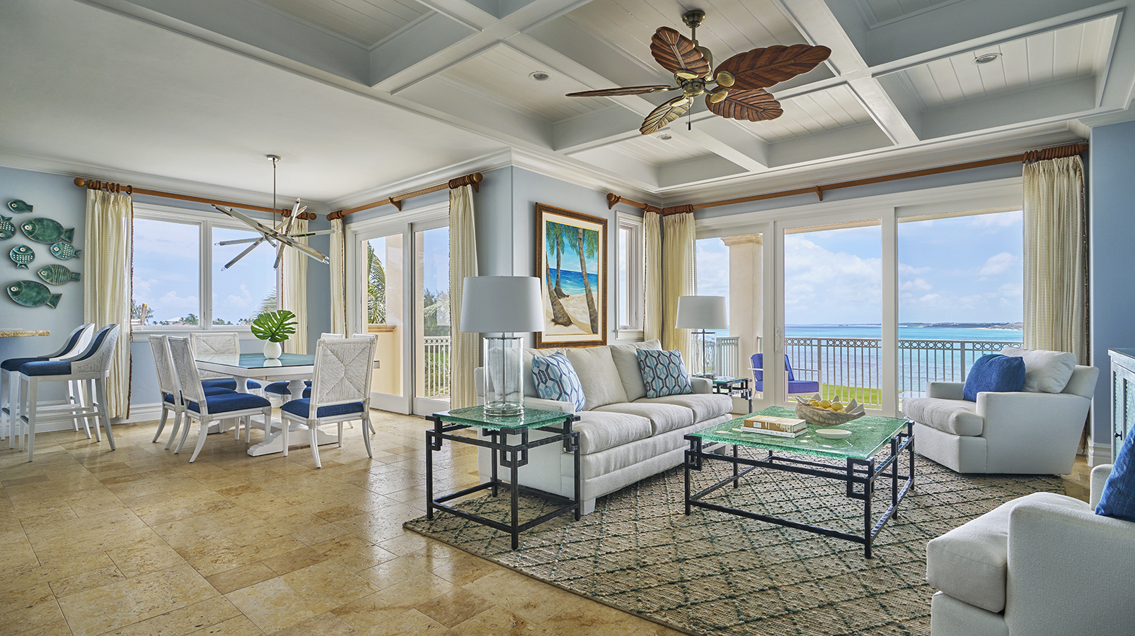 a living room with a couch and table and chairs